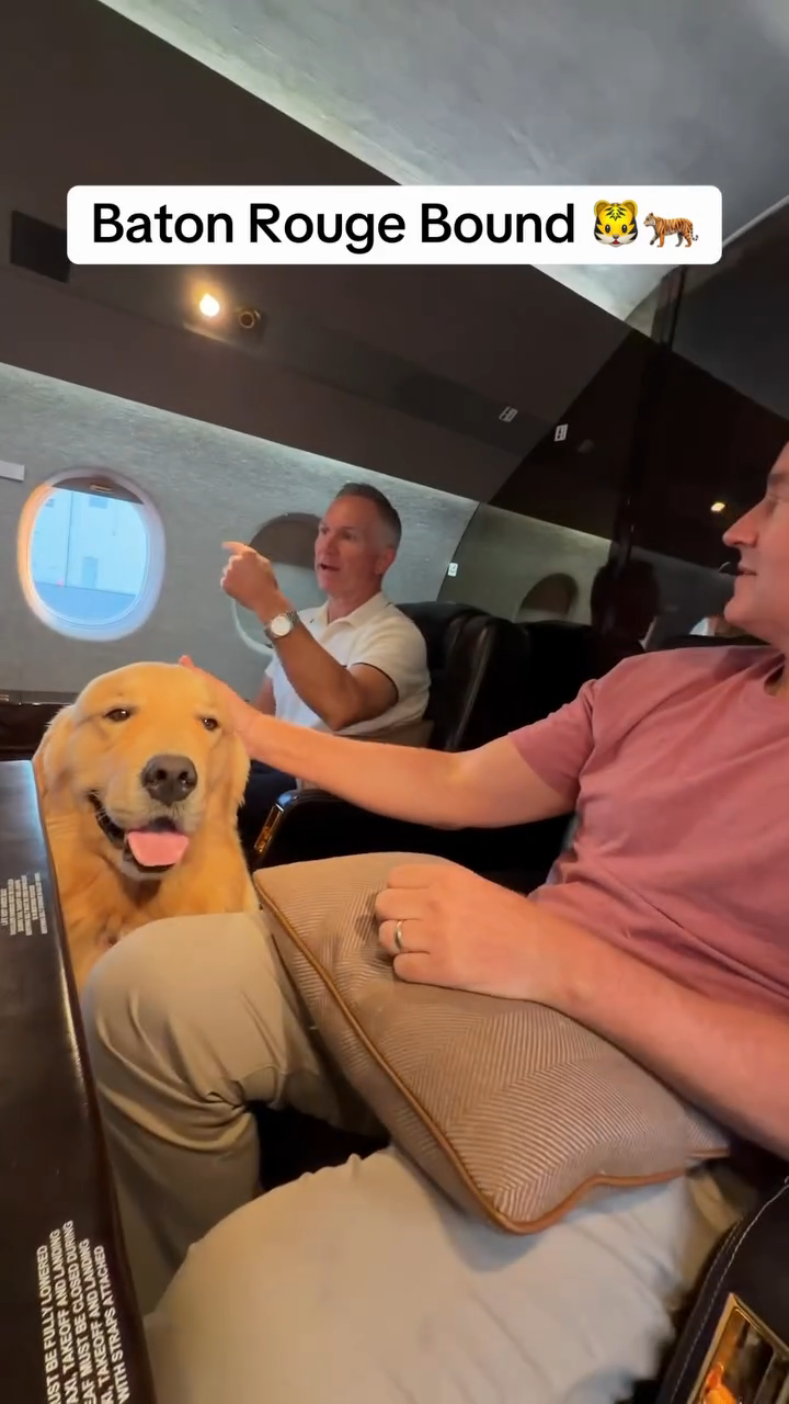 Kirk Herbstreit seated inside Gulfstream N408H with Peter beneath a Baton Rouge Bound caption